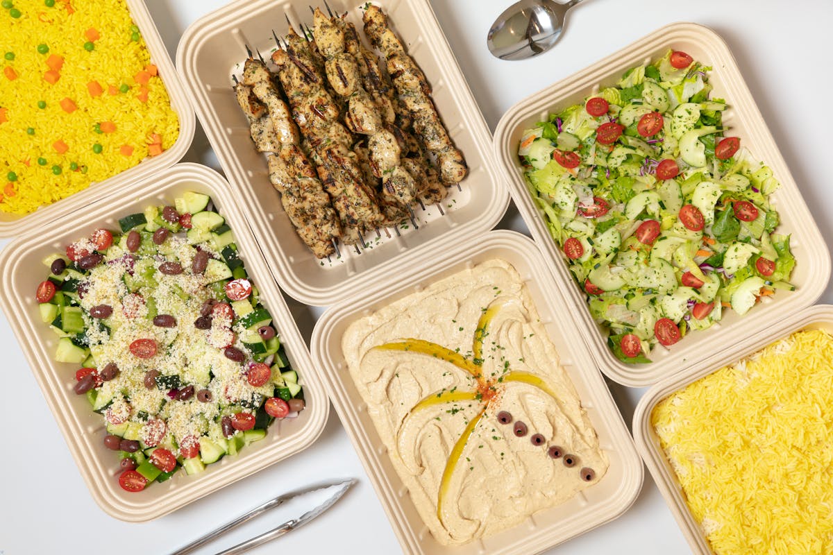 a plastic container filled with different types of food on a tray